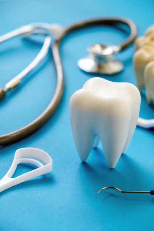 A toothbrush and an assortment of dental tools, emphasizing the importance of maintaining good oral health.